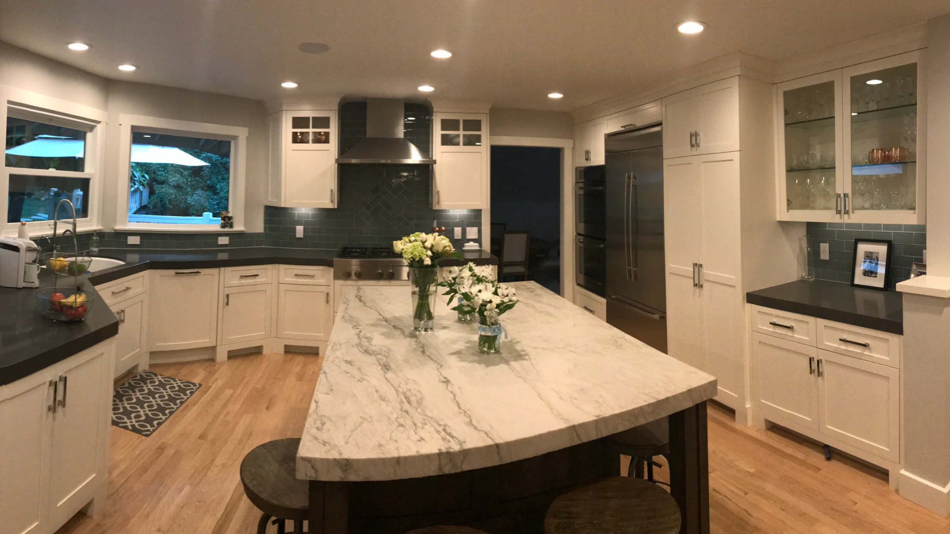 marble table in white and black themed kitchen